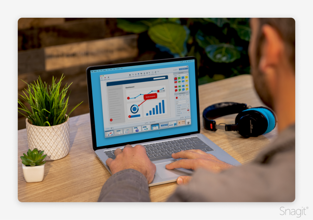 Over-the-shoulder view of a laptop user adding a callout annotation to a chart with Snagit