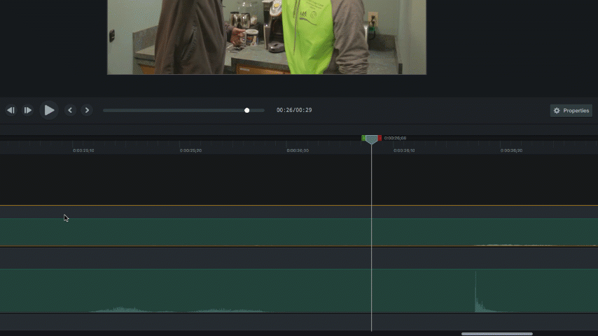 Animated GIF showing the process of syncing audio in video editing software. The video timeline displays separate audio and video tracks being aligned for synchronization.